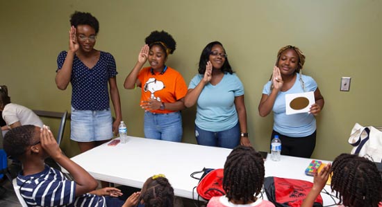 VSU students teach American Sign Language at Summer Feeding and Reading program.